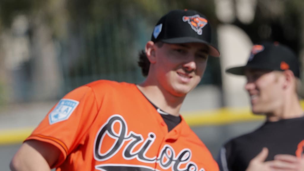 Baltimore Orioles pitchers Nate Karns (36) and Hunter Harvey (56) stretch during workouts at their spring training baseball facility in Sarasota, Fla., Friday, Feb. 15, 2019. (AP Photo/Gerald Herbert)