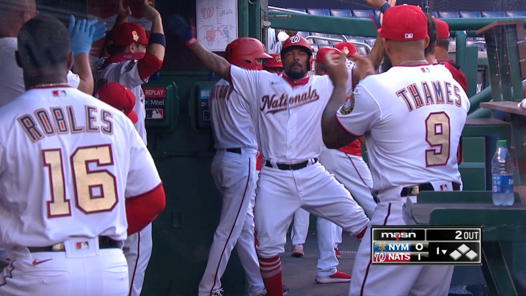 Photo: Nats' Juan Soto smiles from dugout during NLDS Game 4