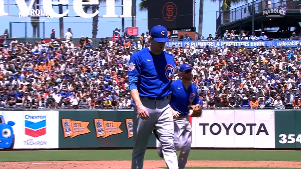 Chicago Cubs' Patrick Wisdom laughs as he reacts to fans during a