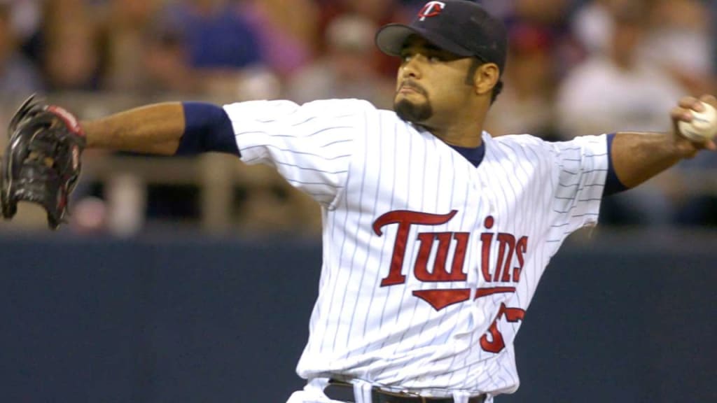 Pitcher Johan Santana wears his new cap and jersey as he stands