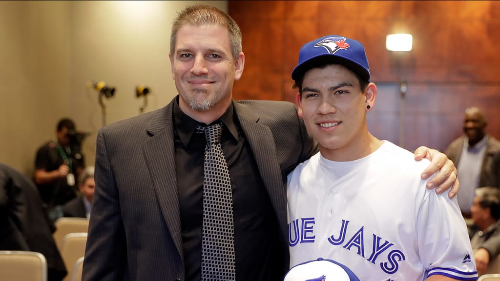 Andrew Tinnish, shown here along with Blue Jays pitcher Eric Pardinho, has been hired by the Braves. (AP)