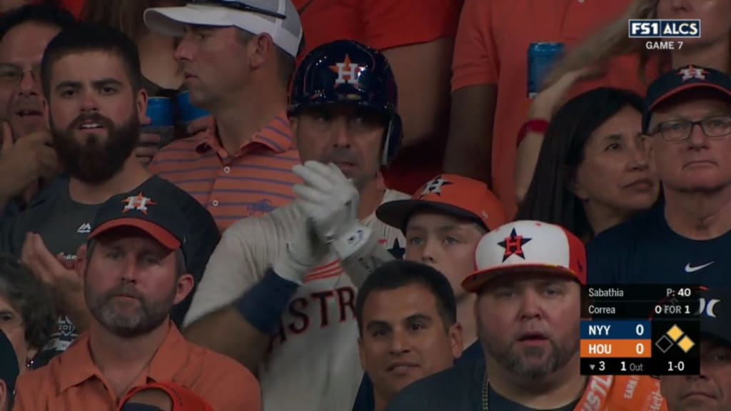 This Astros fan wore a helmet and batting gloves just in case the