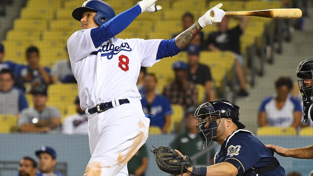 LOS ANGELES, CA - JULY 30: Manny Machado #8 of the Los Angeles Dodgers hits a solo home run in the ninth inning of the game against the Milwaukee Brewers at Dodger Stadium on July 30, 2018 in Los Angeles, California. (Photo by Jayne Kamin-Oncea/Getty Images)