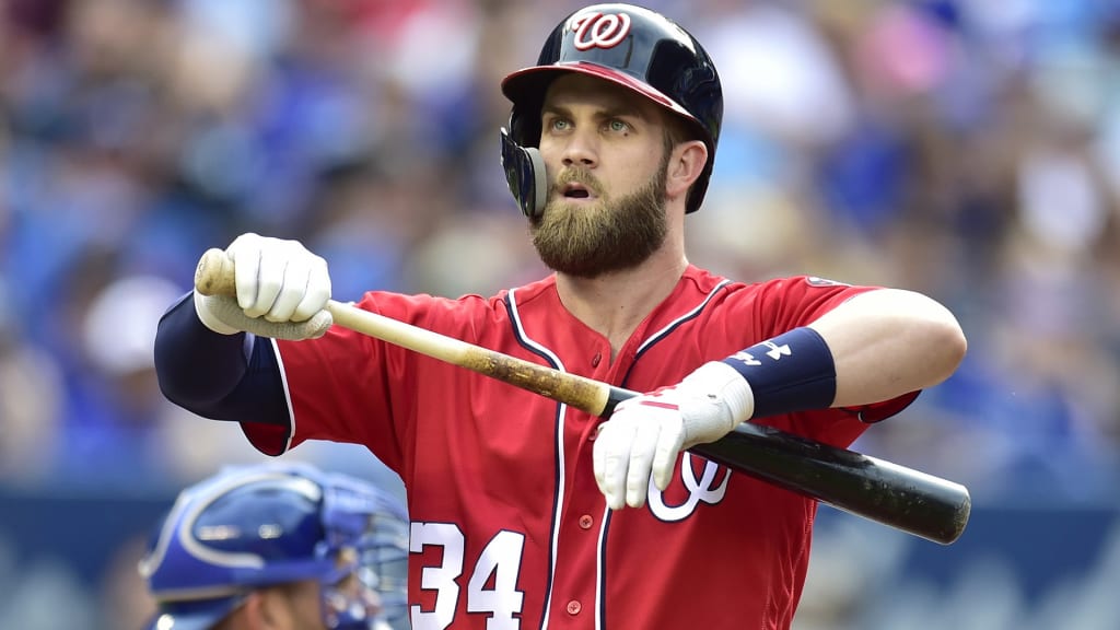 Washington Nationals' Bryce Harper (34) reacts after he struck out looking during the eighth inning of a baseball game against the Toronto Blue Jays in Toronto on Saturday, June 16, 2018. (Frank Gunn/The Canadian Press via AP)