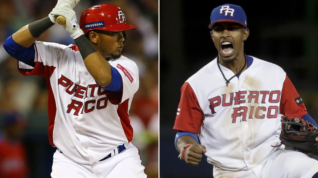 Puerto Rico infielder Francisco Lindor, right, yells after he tagged out  Nicaragua's Juan Diego Montes (99) as Montes tried to steal the second base  during the fourth inning of a World Baseball