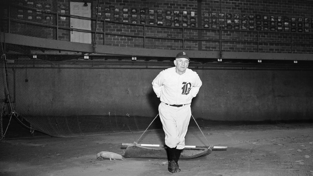 Boston Braves manager Casey Stengel maintains the playing surface at the Choate School in Wallingford, Conn., where the Braves held Spring Training in 1943.