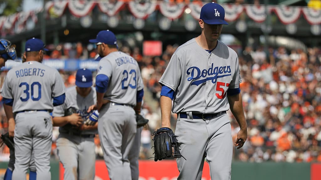 Alex Wood departs after allowing two singles leading off the sixth inning. (AP)