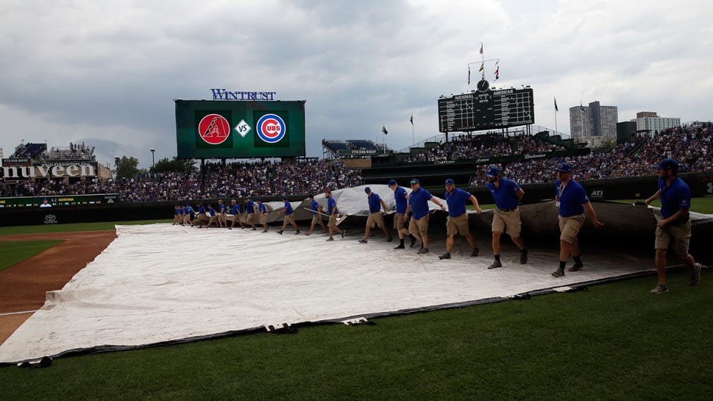 After a one-hour, 30-minute delay before the game, the tarp was brought back out in the second. (AP)