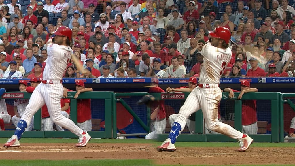 Bryce Harper gives Charlie Manuel water after homers