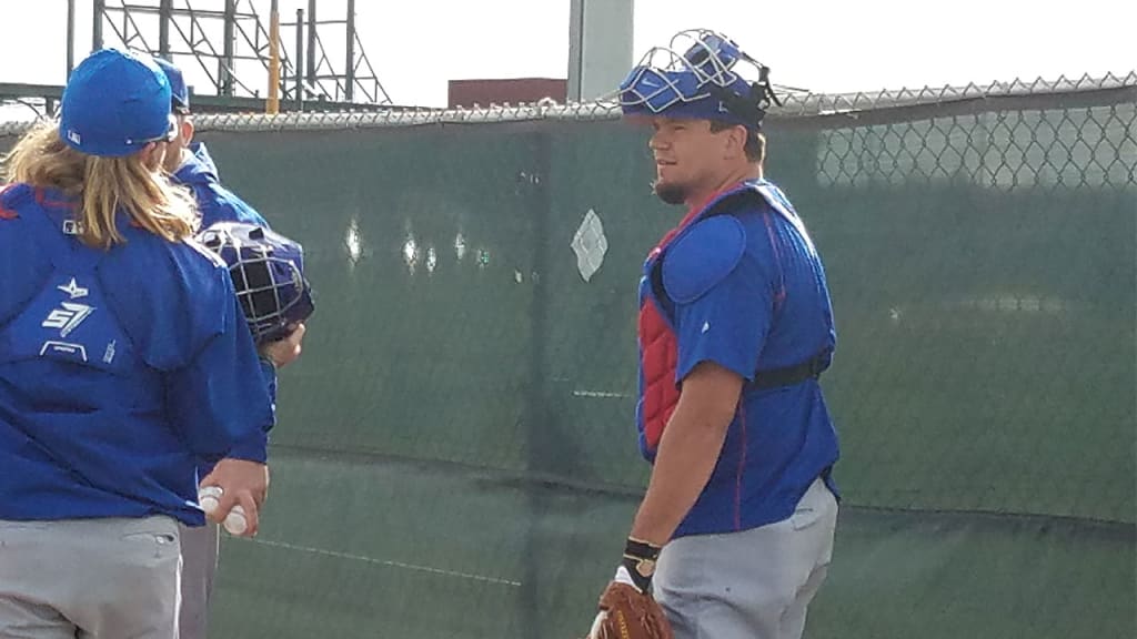 Kyle Schwarber, who is expected to start primarily in left field, caught John Lackey's bullpen session on Friday. (Carrie Muskat)