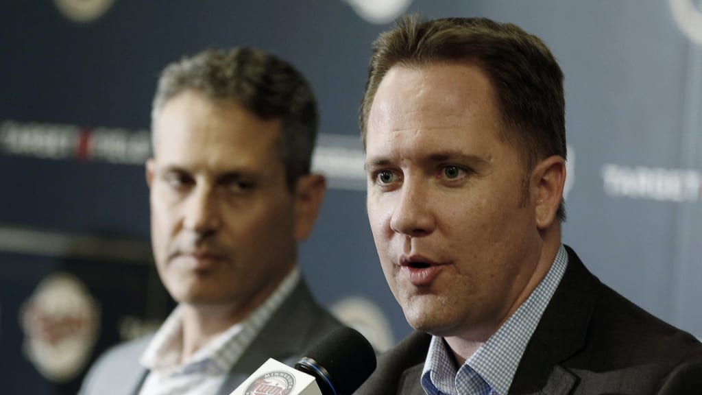 Minnesota Twins chief baseball officer Derek Falvey, right, addresses a news conference Tuesday, Oct.2, 2018 in Minneapolis she he announced that Minnesota Twins manager Paul Molitor was fired, one season after he won the American League Manager of the Year award. In four seasons under Molitor, the Twins went 305-343 with one appearance in the playoffs in 2017. They were 78-84 this year, long out of postseason contention after a series of early setbacks to several key players. Listening at left is general manager Thad Levine. (AP Photo/Jim Mone)