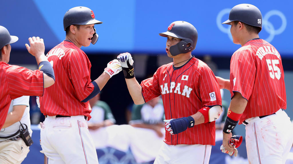 Tetsuto Yamada celebrates with teammates after hitting a three-run home run in the fourth inning.