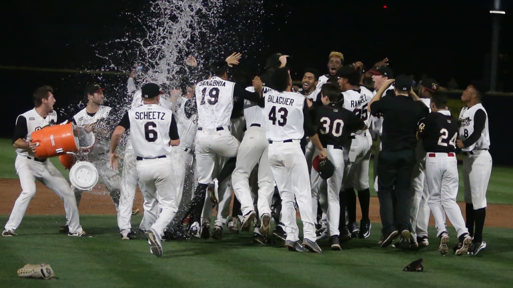 The River Bandits celebrate after winning the Midwest League championship on Sept. 16, 2017 (photo by Rich Guill/Quad Cities River Bandits).