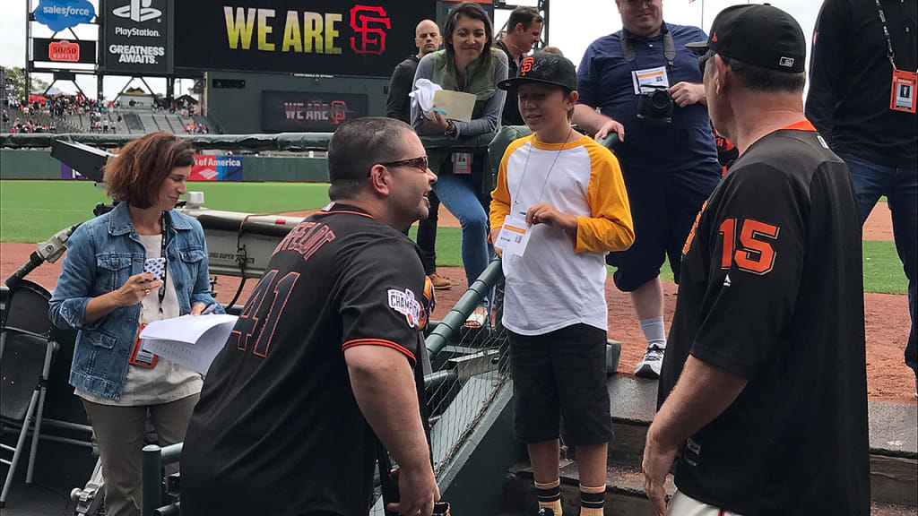 Bryan Stow and Bruce Bochy visit with fans before the game. (MLB.com)