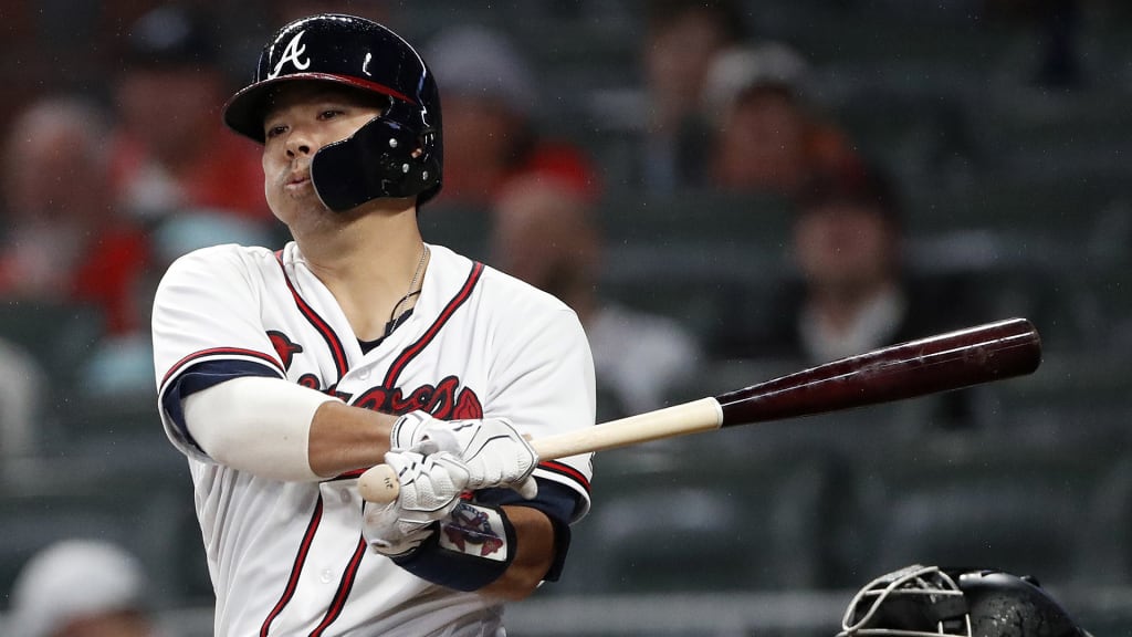 Atlanta Braves' Kurt Suzuki follows through on a three-run double during the fourth inning of the team's baseball game against the Miami Marlins on Tuesday, July 31, 2018 in Atlanta. (AP Photo/John Bazemore)