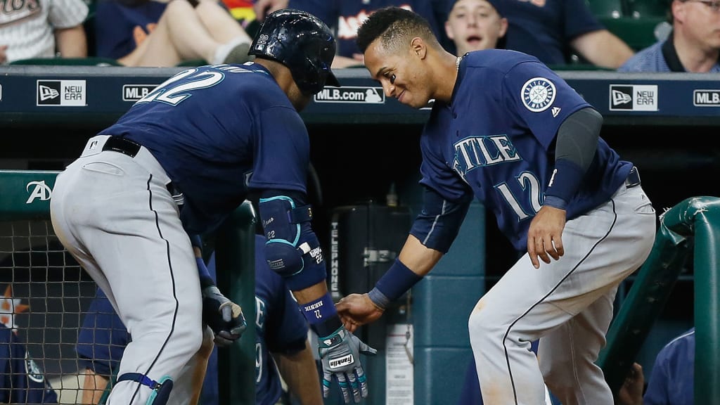 HOUSTON, TX - MAY 07: Robinson Cano #22 of the Seattle Mariners celebrates with Leonys Martin #12 of the Seattle Mariners after hitting a home run in the tenth inning against the Houston Astros on May 07, 2016 in Houston, Texas. (Photo by Bob Levey/Getty Images)