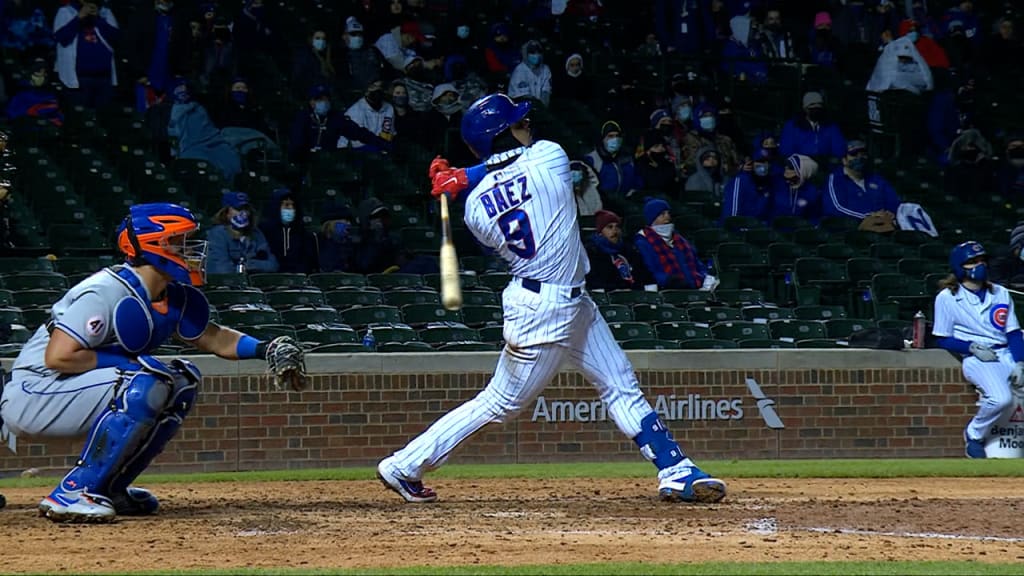 Chicago Cubs shortstop JAVIER BAEZ points to the crowd after hitting a home  run