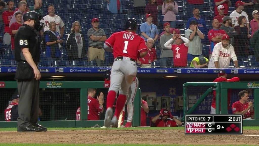 Washington Nationals' Juan Soto, front, stands in the dugout