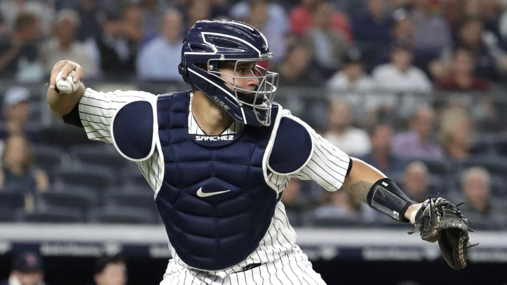 New York Yankees catcher Gary Sanchez fakes a throw to second base during the first inning of a baseball game against the Boston Red Sox, Wednesday, Sept. 19, 2018, in New York. (AP Photo/Julio Cortez)