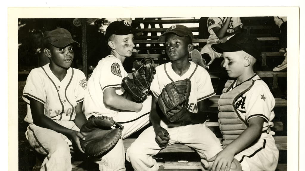 L to R: Jaycees catcher Richard Morris Jr., Kiwanis pitcher Johnny Lane, Jaycees pitcher Robert East, Kiwanis catcher Gary Fleming (Credit: Orlando Sentinel)