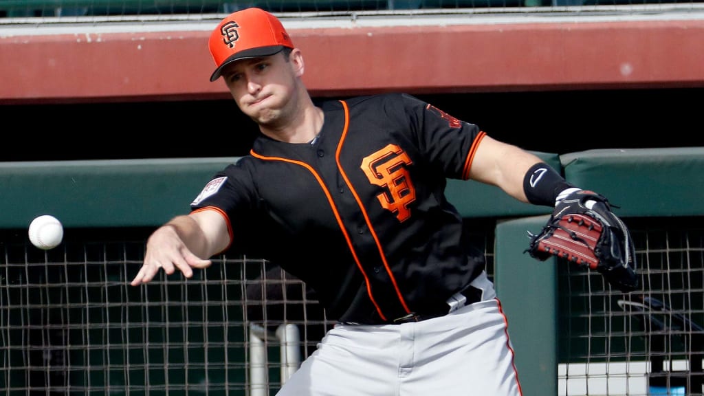 Giants catchers work on the back pick, a favorite Buster Posey play