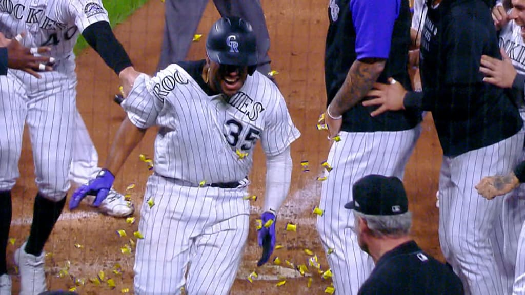 Elias Diaz of the Colorado Rockies celebrates with Brendan Rodgers