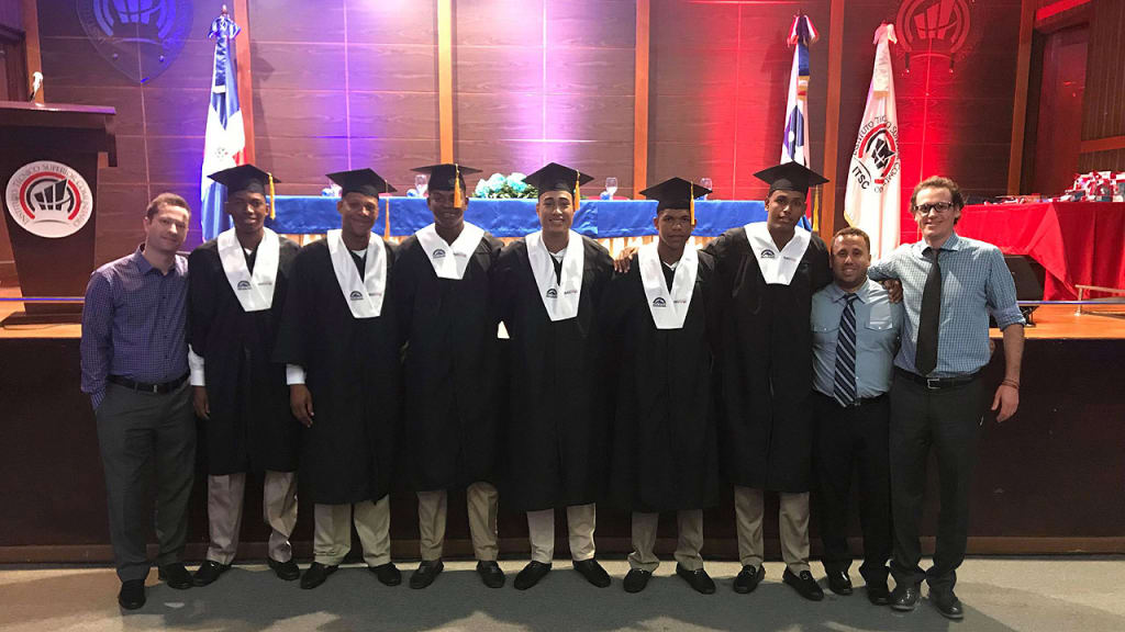 Left to right: Zach Wilson, Jefry Valdez, Alexander Martinez, Raymells Rosa, Helcris Olivarez, Jose Grullart, Aneudy Duarte, Angel Amparo, and Josh Rosenthal (Rockies)