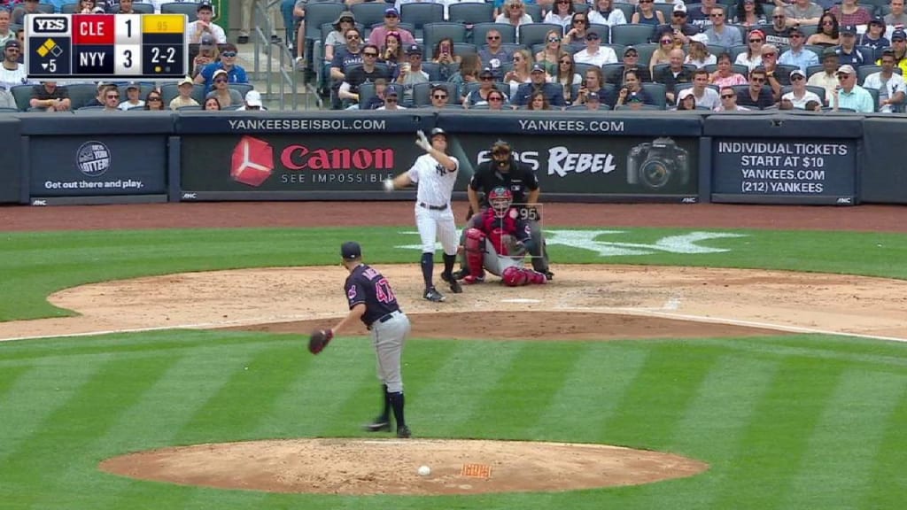 Cleveland Indians shortstop Francisco Lindor commits a fielding error on a  ground ball by New York Yankees' Ronald Torreyes with the bases loaded  during the fifth inning of a baseball game allowing