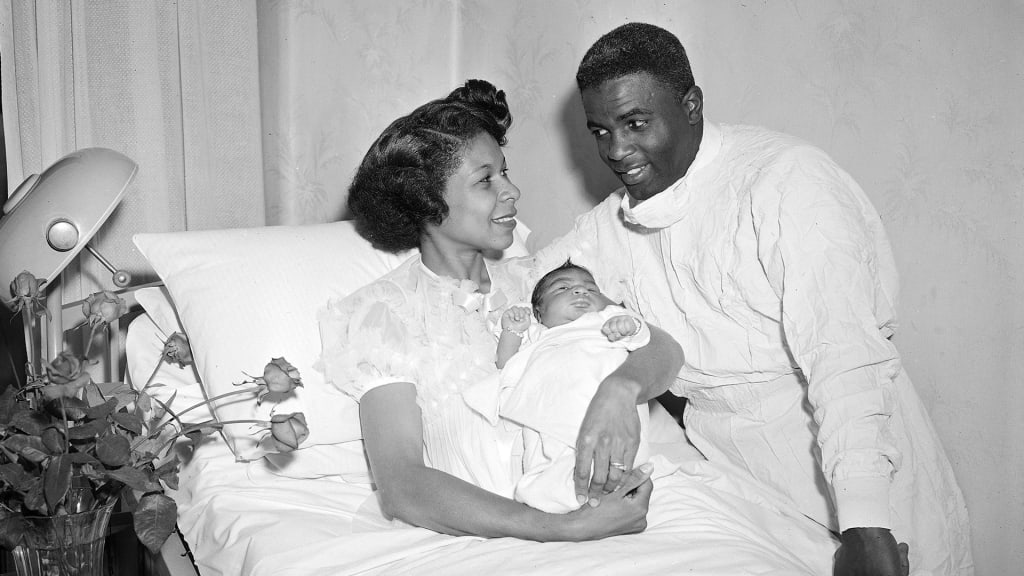 Baseball legend Jackie Robinson looks at this wife Rachel as she holds their second son, David, at Flower Fifth Avenue Hospital in New York, May 15, 1952.