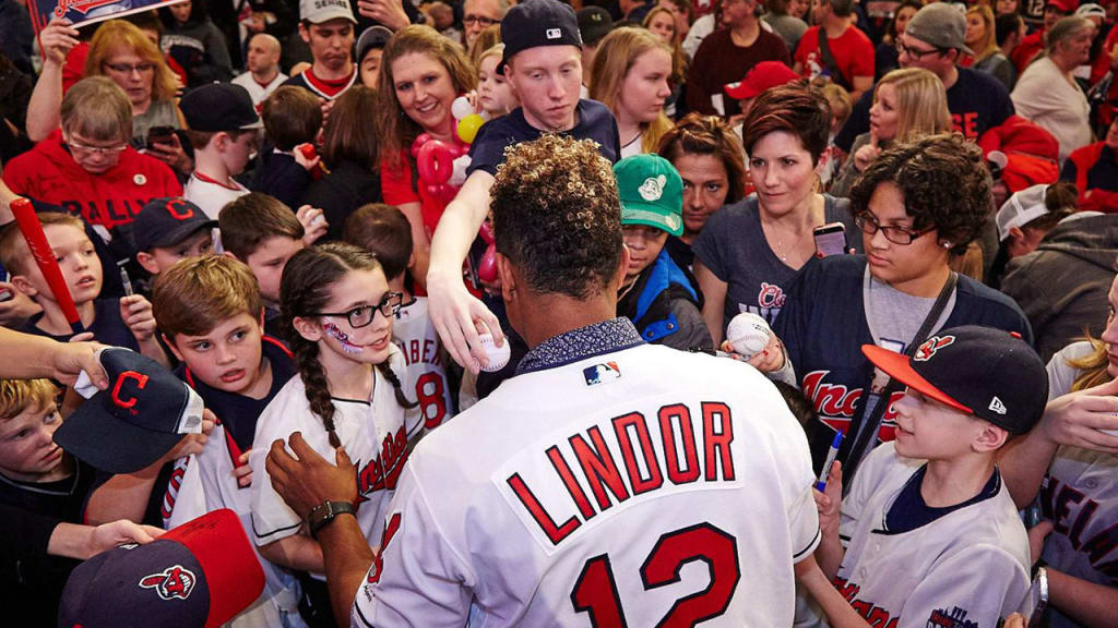 Indians shortstop Francisco Lindor (center) signs autographs for fans at Tribe Fest in 2017. (Indians)