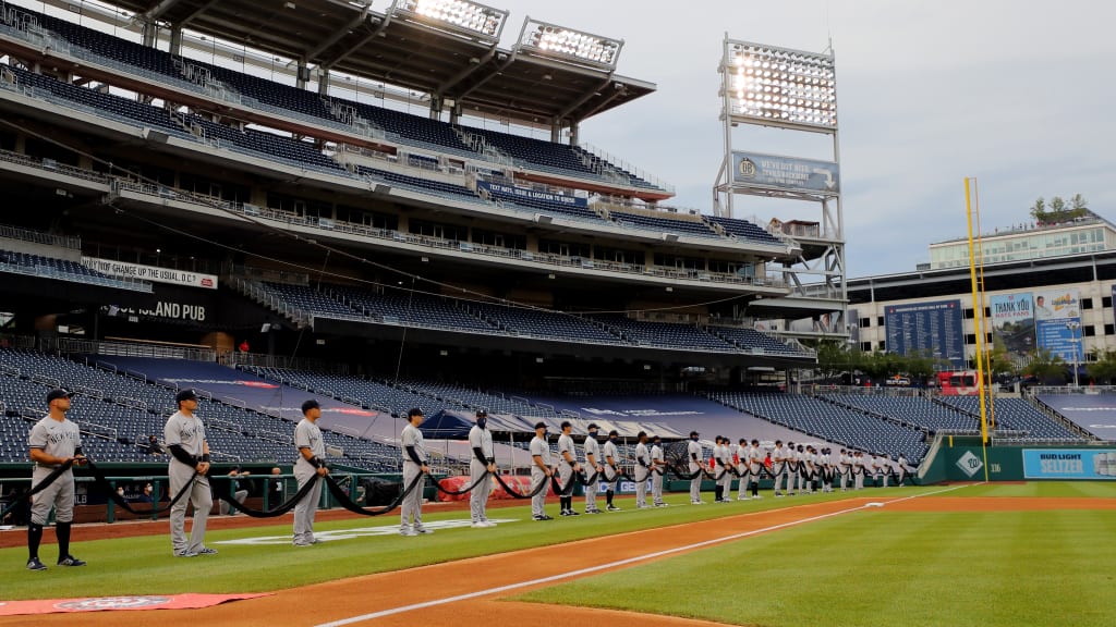 With the long-delayed 2020 season beginning amid an air of social unrest across the country, the Yankees and Nationals joined together for a pregame tribute, with players from both teams holding a black ribbon to symbolize unity. The joyful return of baseball couldn’t blot out the issues outside the ballparks, from the devastating impact of COVID-19 to the fight for social justice. (Credit: Triumph Books)