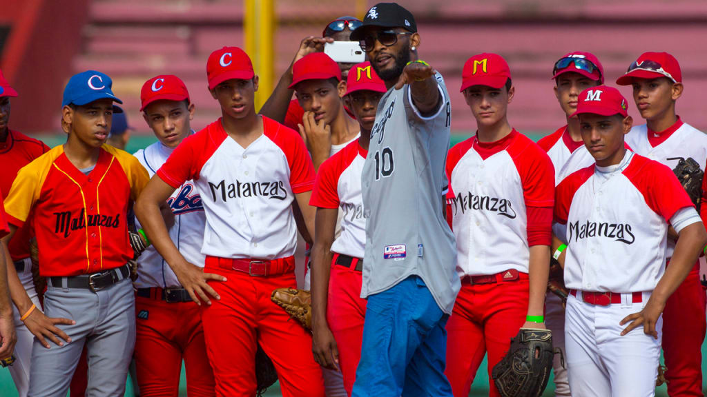 The Padres' Alexei Ramirez, who left Cuba in 2007, leads a clinic for young players in Cuba in December. (AP)