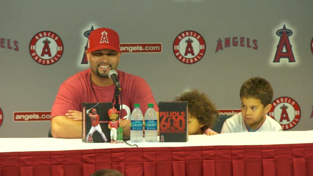 Albert Pujols yanks out Bartolo Colon's jersey 