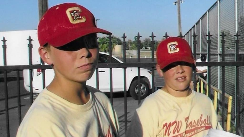 (Rick Burnes: “High school summer league. Corbin was going into his junior year, Tyler a freshman.”)