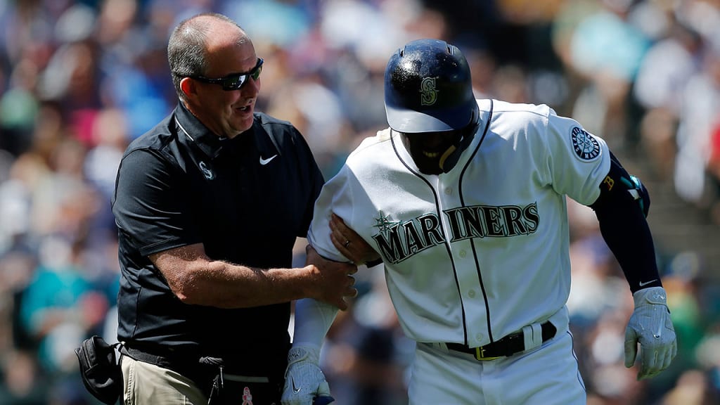 Rick Griffin, tending to Guillermo Heredia, is looking forward to more time with his wife and three daughters. (Mariners/Ben Van Houten)