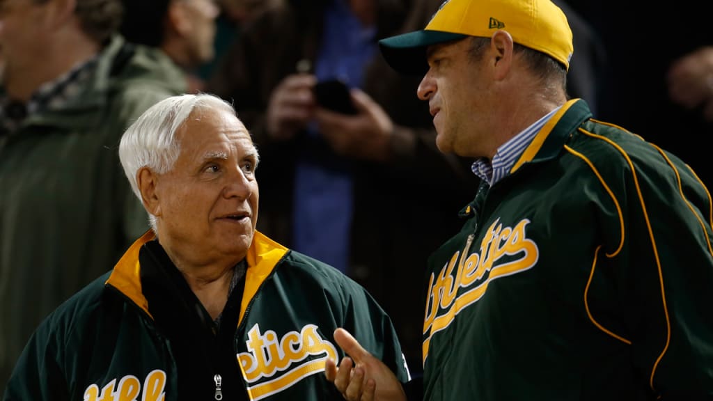 Lew Wolff (left), John Fisher (right) and a limited partnership group purchased the A's in April 2005.