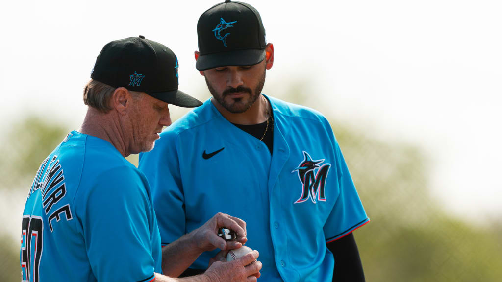 Miami Marlins pitching coach Mel Stottlemyre, center, talks with pitcher  Elieser Hernandez (57) during the first inning of the team's baseball game  against the Pittsburgh Pirates, Friday, Sept. 17, 2021, in Miami. (