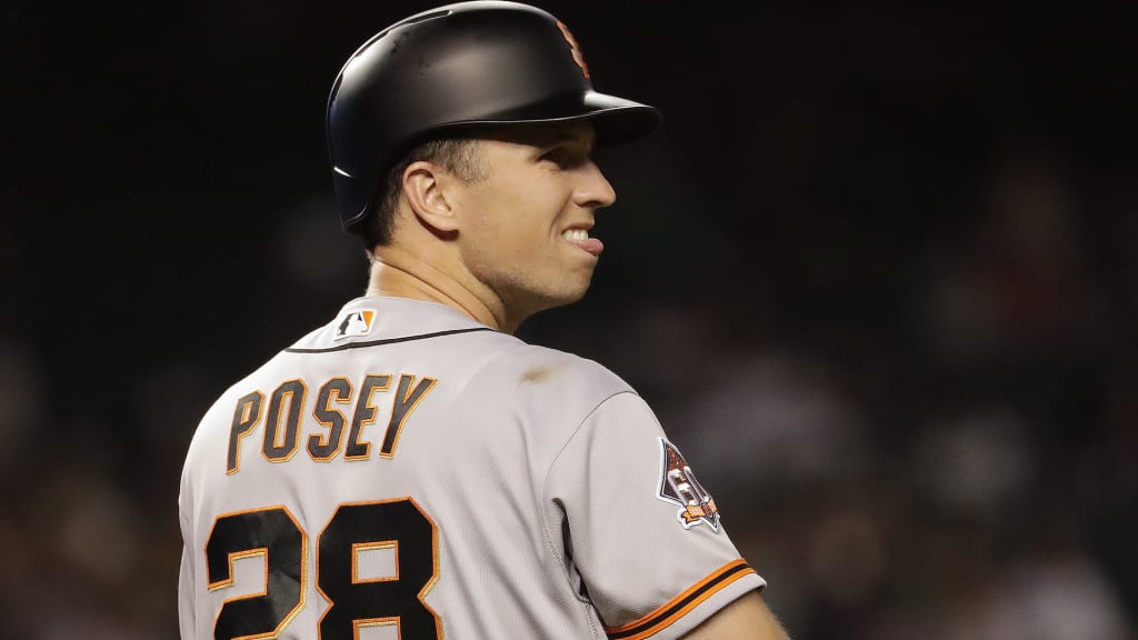 San Francisco Giants catcher Buster Posey hits against the Arizona Diamondbacks during the first inning of a baseball game Thursday, April 19, 2018, in Phoenix. (AP Photo/Matt York)
