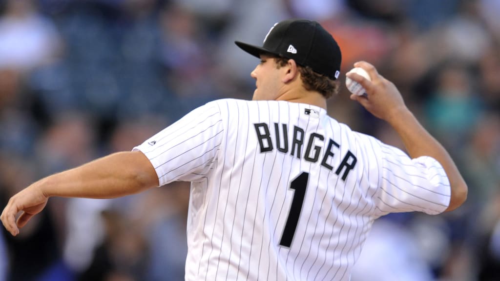Chicago White Sox first-round draft pick Jake Burger throws out the ceremonial first pitch before a baseball game between the Chicago White Sox and the New York Yankees Monday, June 26, 2017, in Chicago. (AP Photo/Paul Beaty)
