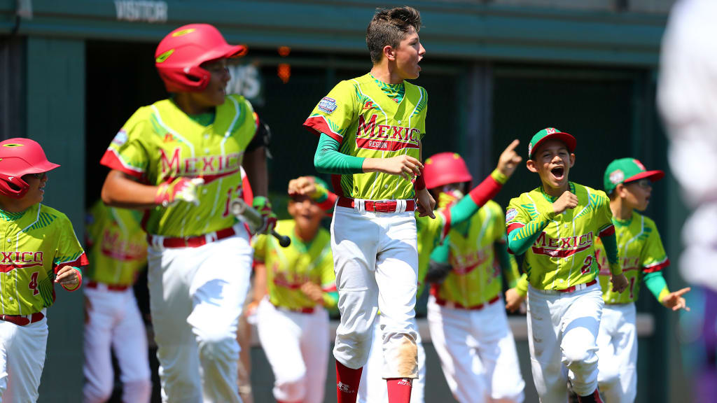 Mexico players run to meet Gael Isaac Cortez after he hit a home run against Italy during Day 3 of the Little League World Series. (Alex Trautwig/MLB Photos)