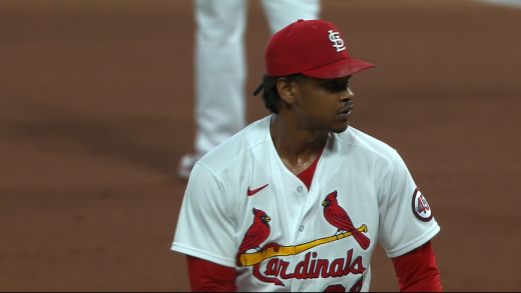 St. Louis Cardinals Vince Coleman, center, lies on the field of