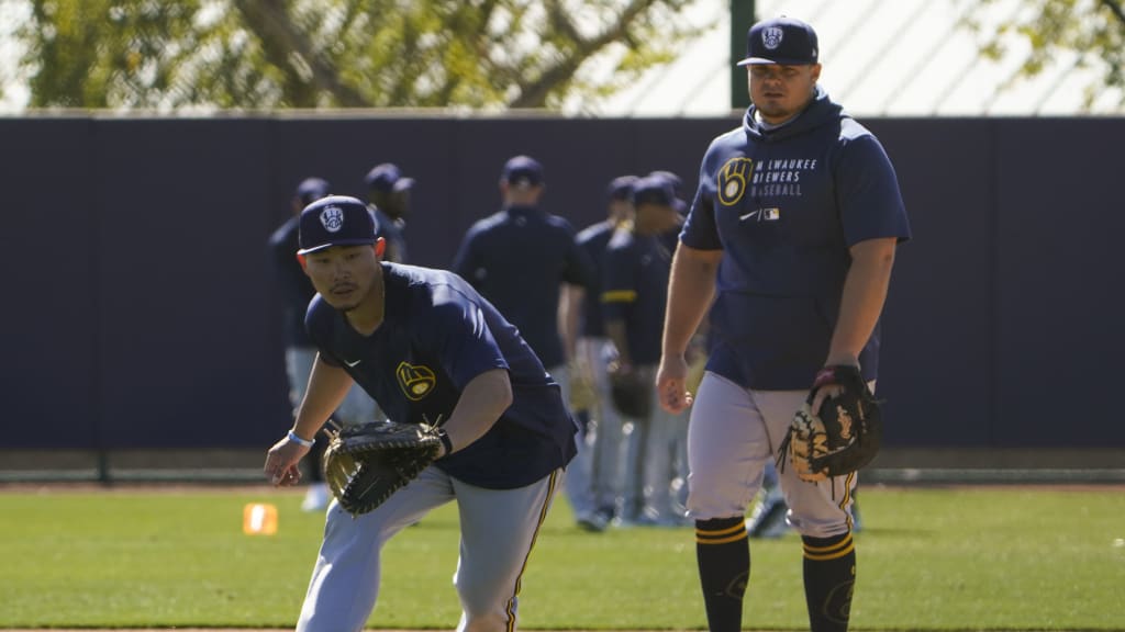 Keston Hiura and Daniel Vogelbach work on fielding drills at camp.