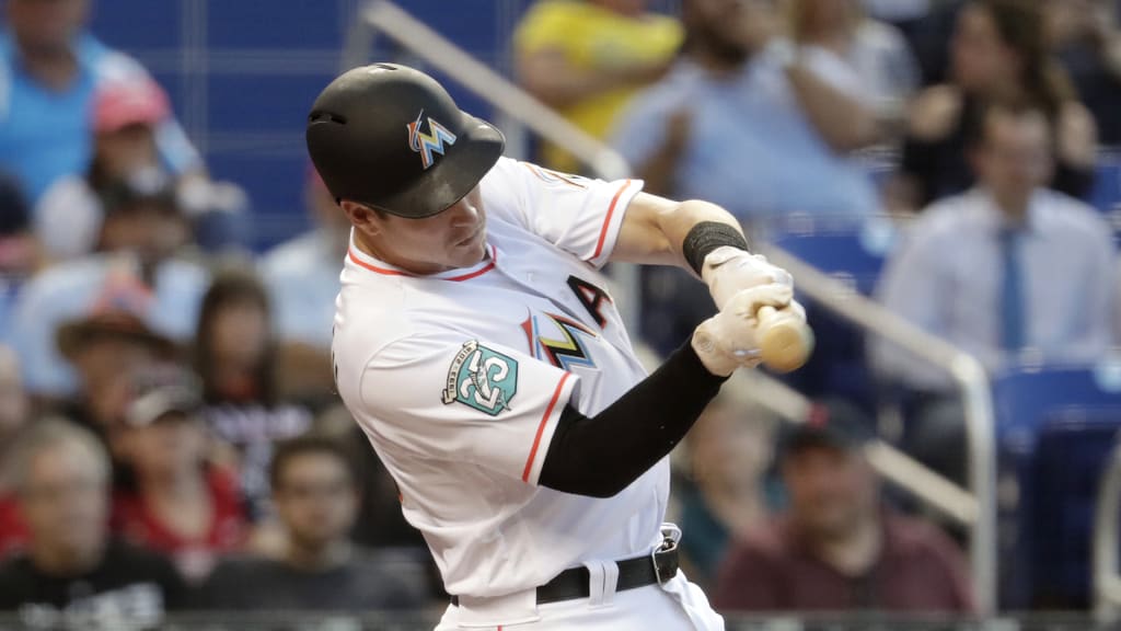 Miami Marlins' Brian Anderson hits a single in the fourth inning of a baseball game against the Boston Red Sox, Tuesday, April 3, 2018, in Miami. (AP Photo/Lynne Sladky)