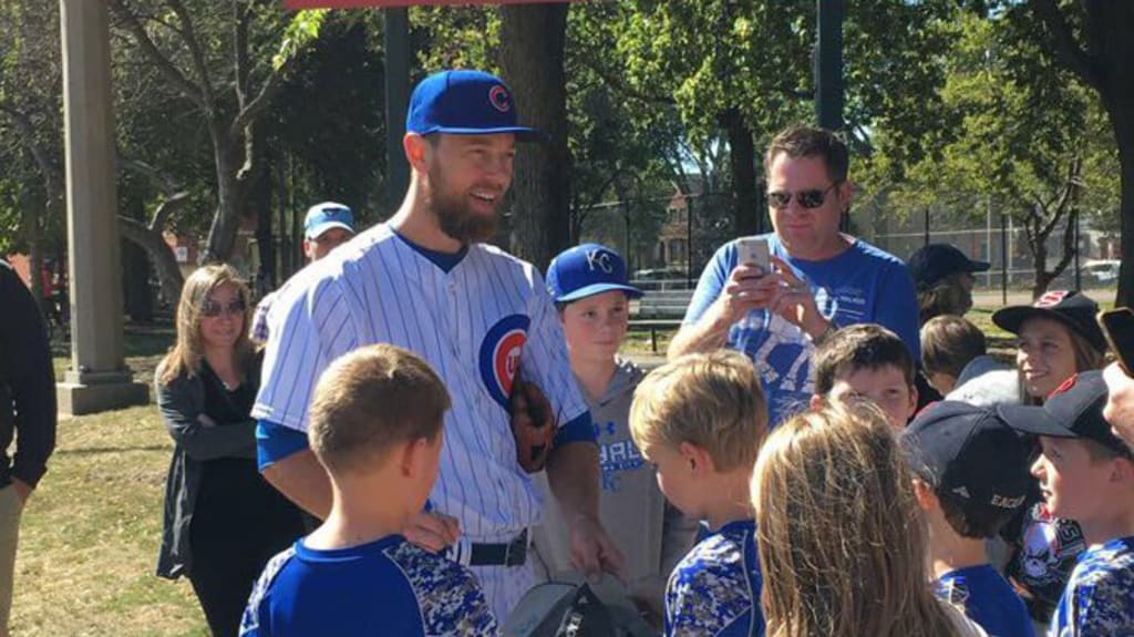 A fully uniformed Ben Zobrist biked to the park with his family to watch  some sandlot baseball