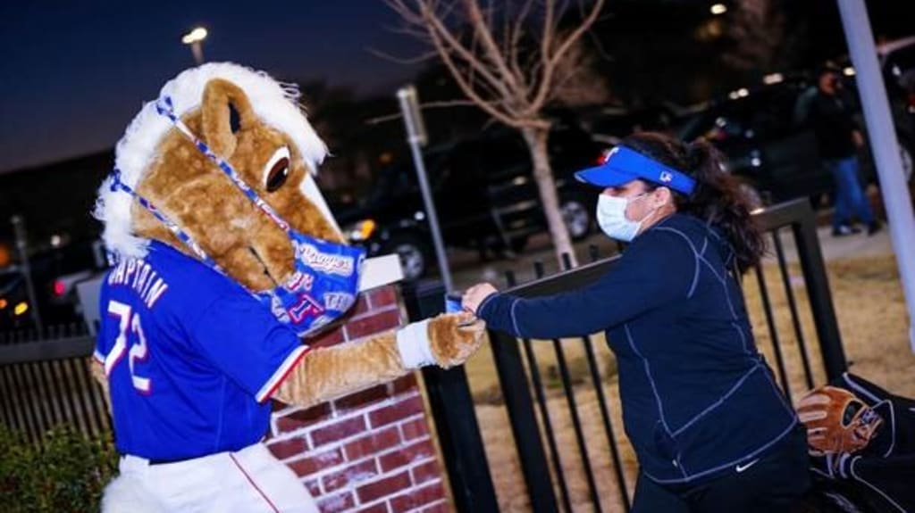 Rangers Captain distributes a facemask at the Academy on Jan. 13.