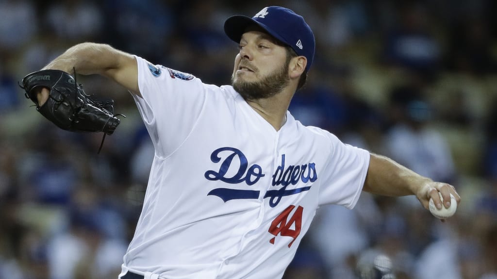 Los Angeles Dodgers starting pitcher Rich Hill throws during the first inning of Game 4 of the National League Championship Series baseball game against the Milwaukee Brewers Tuesday, Oct. 16, 2018, in Los Angeles. (AP Photo/Matt Slocum)