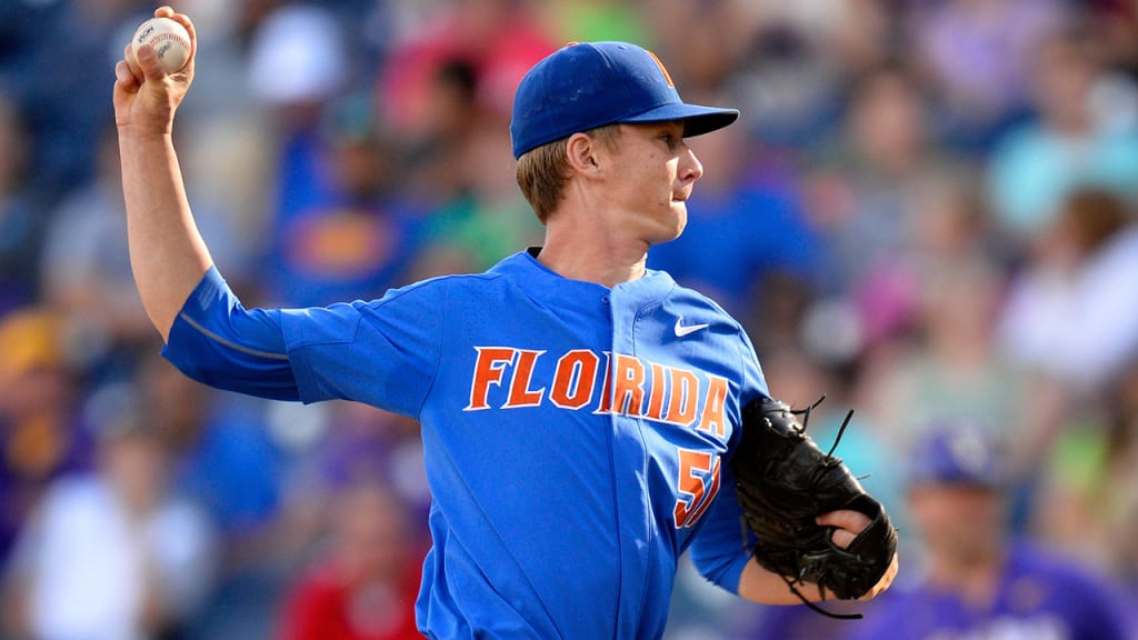 Brady Singer struck out a record 12 batters in Game 1 of the NCAA College World Series baseball finals against LSU. (AP)