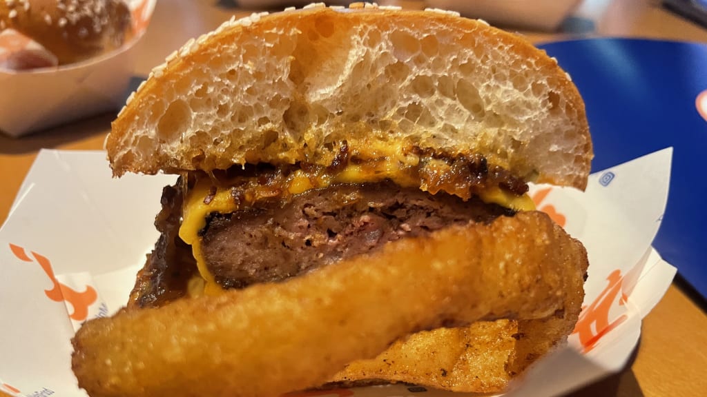 The Polar Burger 2.0 -- hidden behind an onion ring -- from Alonso's Arctic Grill