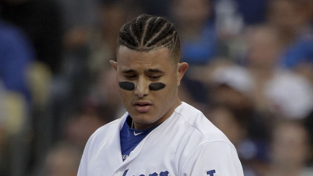 Los Angeles Dodgers' Manny Machado throws his helmet after striking out against the Boston Red Sox during the first inning in Game 5 of the World Series baseball game on Sunday, Oct. 28, 2018, in Los Angeles. (AP Photo/Jae C. Hong)