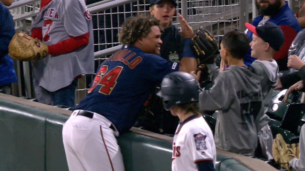 Willians Astudillo takes off his hat to catch a pop-up with his